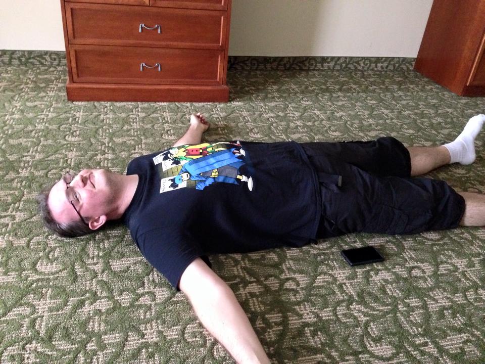 It's me, laying on the floor of our hotel room, arms spread wide
